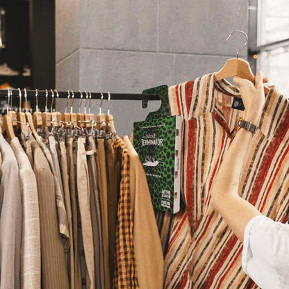 Carpet moth trap hanging inside a wardrobe to help monitor clothes moth activity