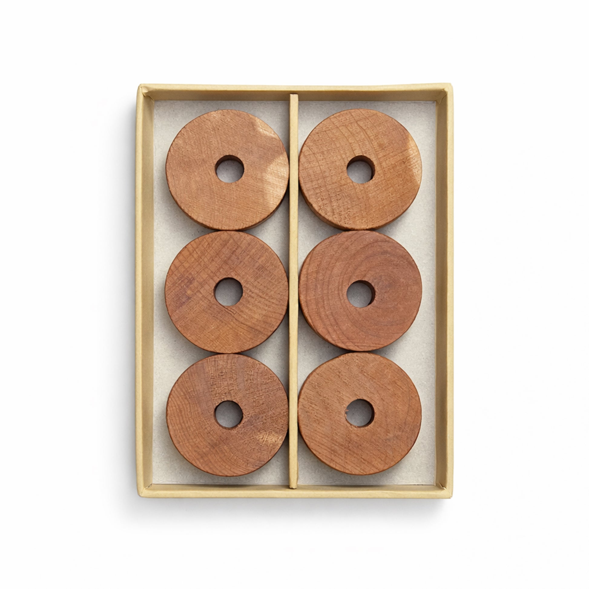 Set of six natural cedarwood rings neatly presented for wardrobe and hanger use